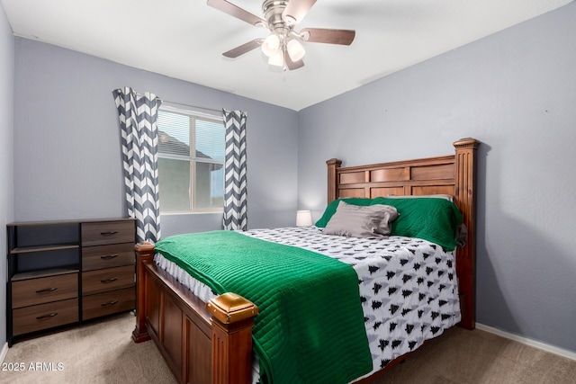 bedroom with baseboards, light carpet, and ceiling fan