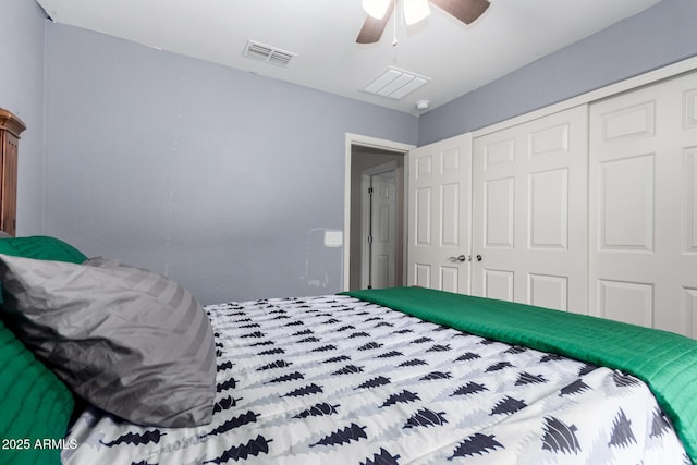 bedroom with a closet, visible vents, and ceiling fan