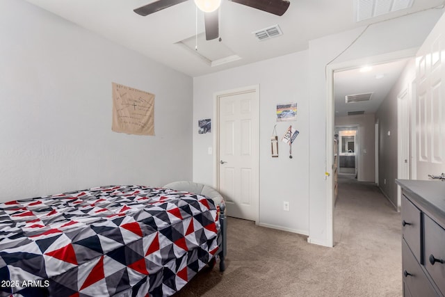 bedroom with visible vents, light carpet, and a ceiling fan