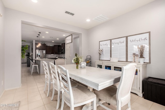 dining area with recessed lighting, visible vents, and light tile patterned flooring