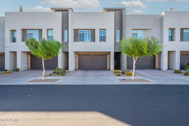 1956 W Kinfield Trl, Phoenix, AZ 85085 - multi unit property with stucco siding, driveway, and an attached garage