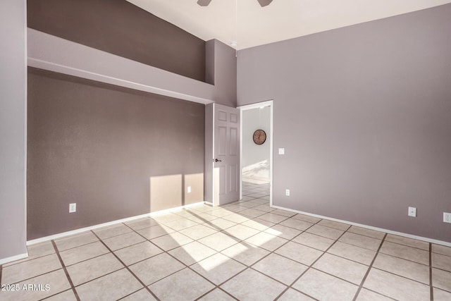 14216 N Saguaro Blvd Unit A, Fountain Hills, AZ 85268 - tiled spare room featuring baseboards, ceiling fan, and a high ceiling