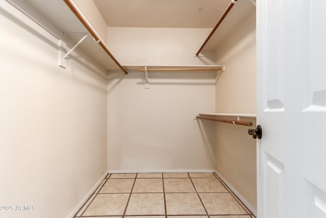 14216 N Saguaro Blvd Unit A, Fountain Hills, AZ 85268 - walk in closet with light tile patterned flooring