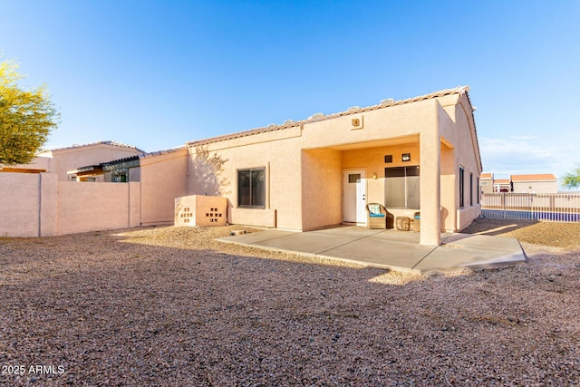 14216 N Saguaro Blvd Unit A, Fountain Hills, AZ 85268 - back of property featuring fence, a patio, stucco siding, and a tiled roof