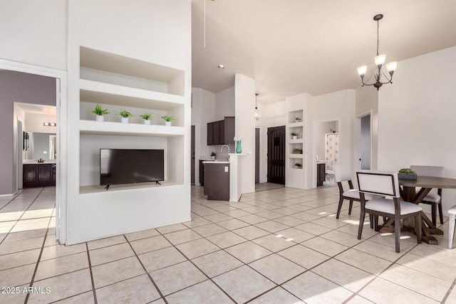 14216 N Saguaro Blvd Unit A, Fountain Hills, AZ 85268 - living area with high vaulted ceiling, a chandelier, built in features, and light tile patterned floors
