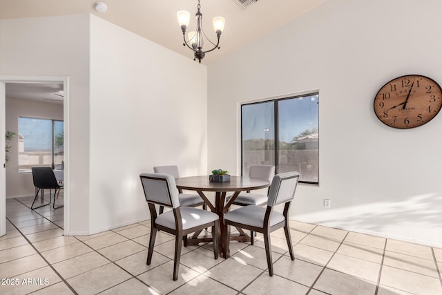 14216 N Saguaro Blvd Unit A, Fountain Hills, AZ 85268 - dining area with light tile patterned flooring, a notable chandelier, and vaulted ceiling