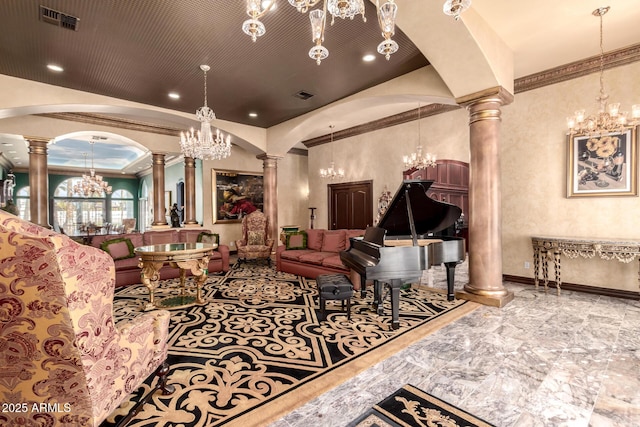 living room featuring an inviting chandelier, ornamental molding, and ornate columns