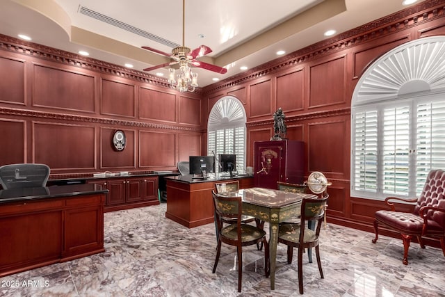 office with ceiling fan and a tray ceiling