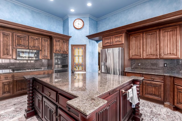 kitchen with stainless steel appliances, ornamental molding, dark stone countertops, and decorative backsplash