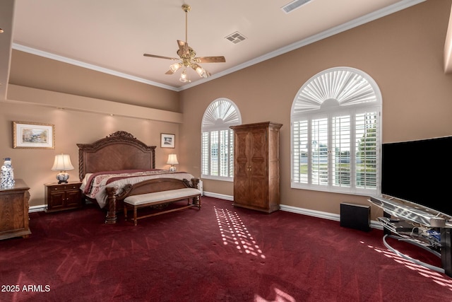 carpeted bedroom with ceiling fan and ornamental molding