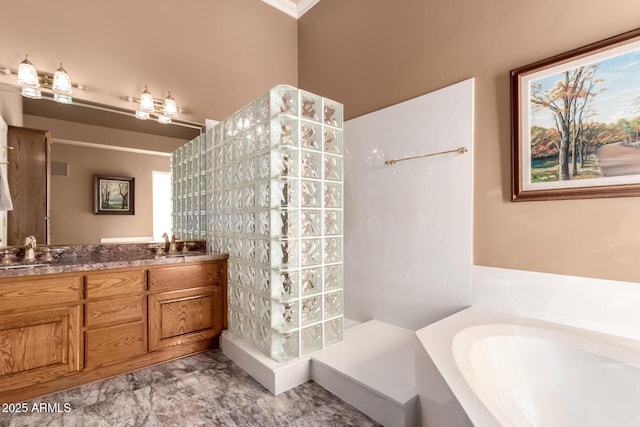 bathroom with vanity and a bath