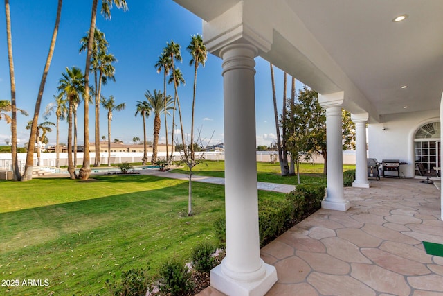 view of patio featuring a grill and a porch