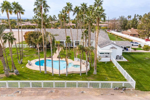 view of swimming pool featuring a patio and a lawn