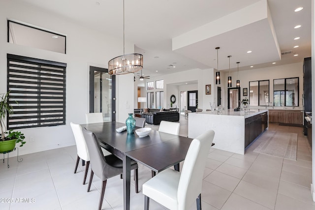 dining space with an inviting chandelier, light tile patterned floors, recessed lighting, and visible vents