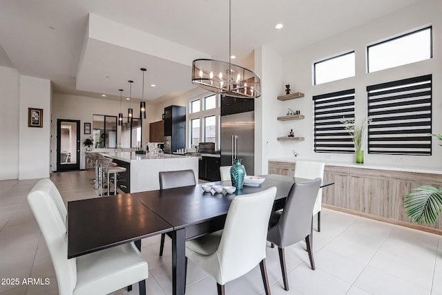 dining room with recessed lighting and a notable chandelier