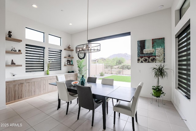 dining room featuring an inviting chandelier, recessed lighting, and light tile patterned flooring