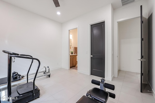 workout area featuring ceiling fan, recessed lighting, baseboards, light tile patterned floors, and visible vents