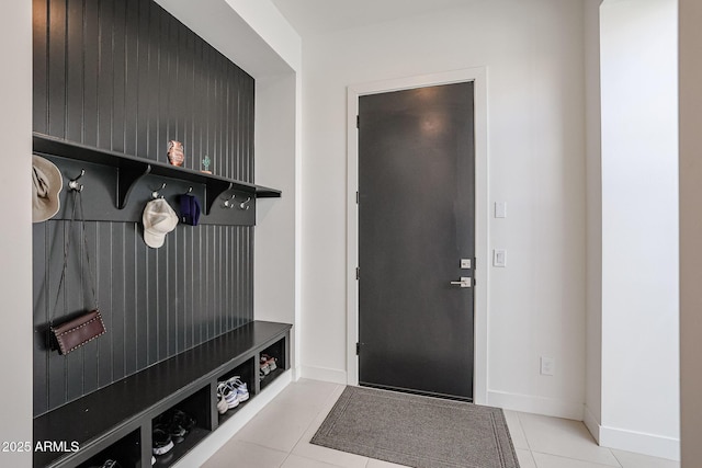 mudroom featuring baseboards and tile patterned flooring