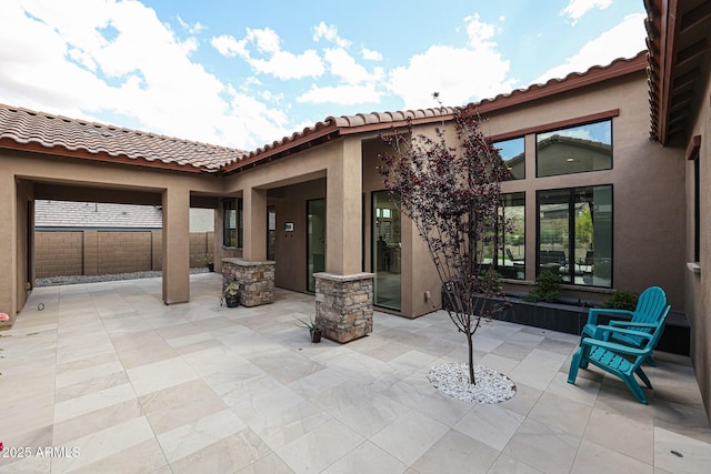 view of patio featuring fence
