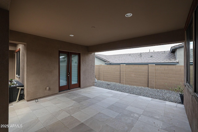 view of patio featuring french doors and a fenced backyard