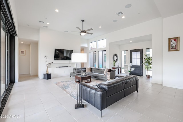 living room with visible vents, recessed lighting, ceiling fan, and light tile patterned flooring