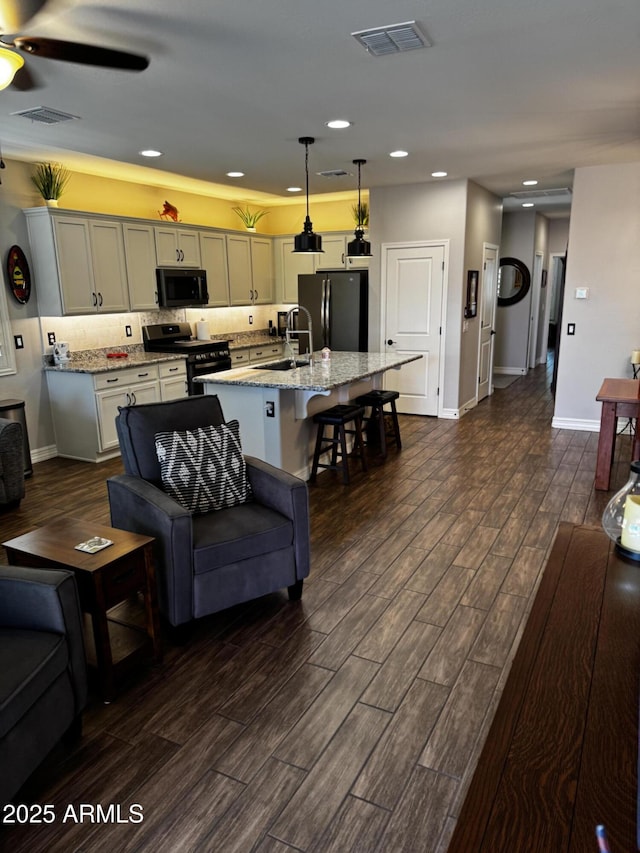 10704 E Twister Ave, Mesa, AZ 85212 - living area with dark wood-type flooring, a ceiling fan, baseboards, and recessed lighting