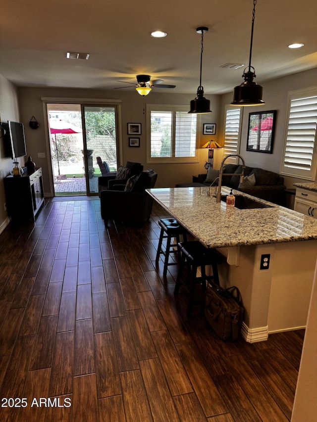 10704 E Twister Ave, Mesa, AZ 85212 - kitchen with a sink, dark wood-style flooring, open floor plan, and recessed lighting