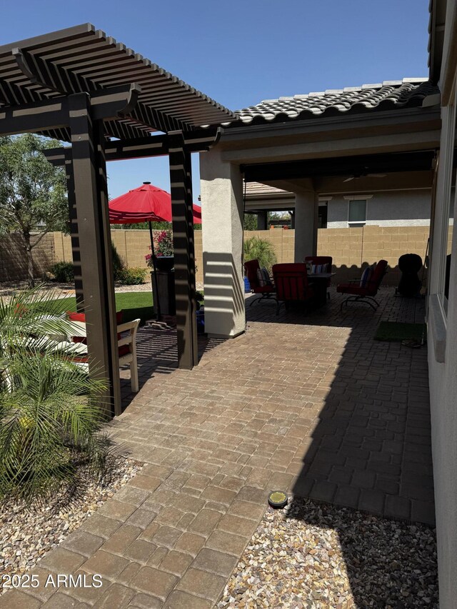 10704 E Twister Ave, Mesa, AZ 85212 - fenced backyard featuring a pergola, a patio, and outdoor lounge area