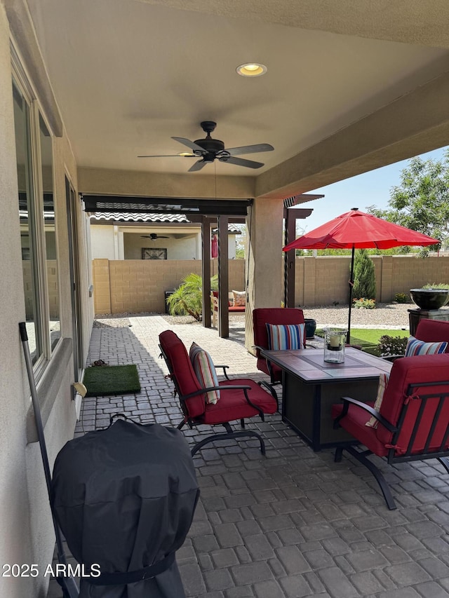 10704 E Twister Ave, Mesa, AZ 85212 - fenced backyard featuring a patio area and a ceiling fan