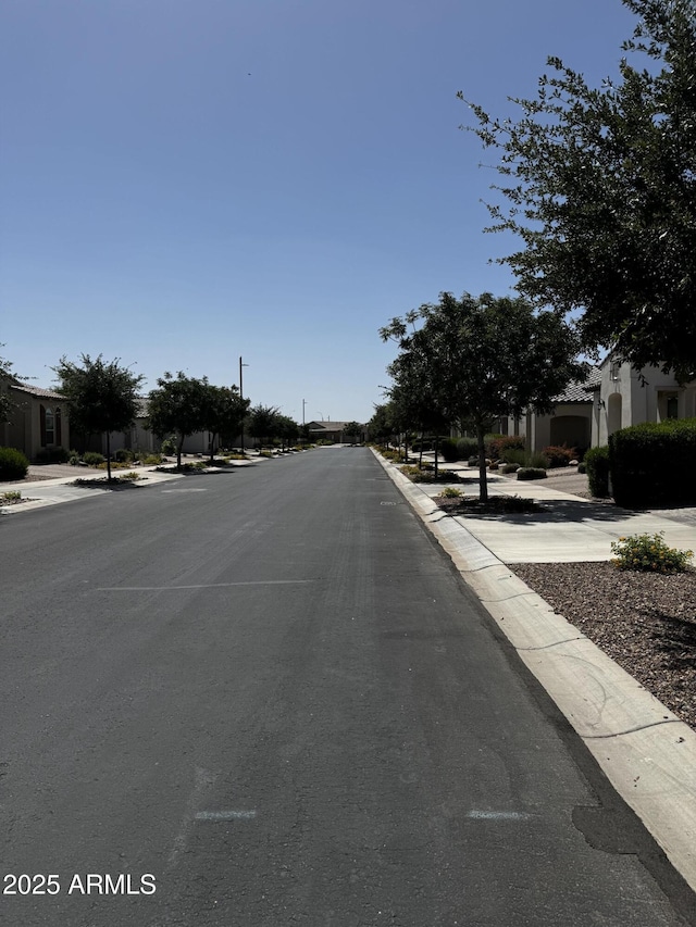 10704 E Twister Ave, Mesa, AZ 85212 - view of asphalt street featuring sidewalks and curbs