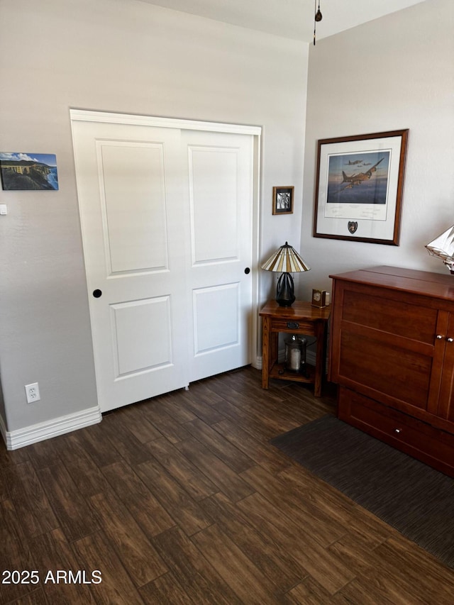 10704 E Twister Ave, Mesa, AZ 85212 - bedroom with dark wood-type flooring, a closet, and baseboards