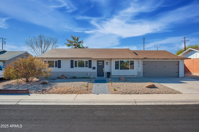 single story home featuring a garage