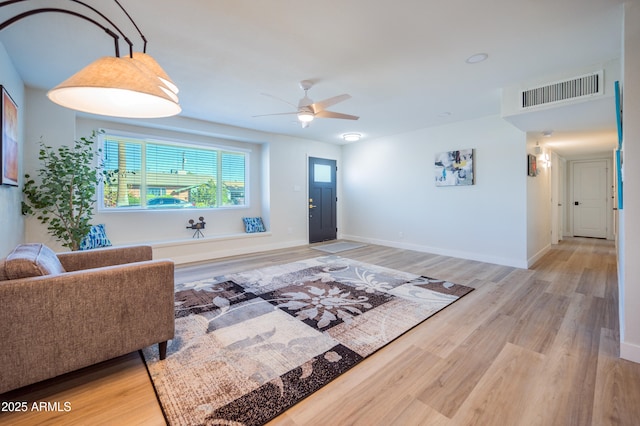 entryway featuring ceiling fan and light hardwood / wood-style flooring