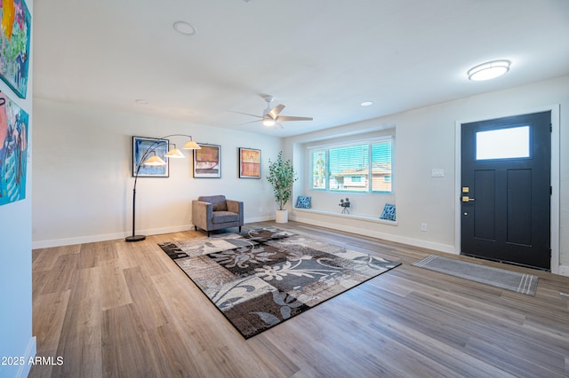 entrance foyer with ceiling fan and light wood-type flooring