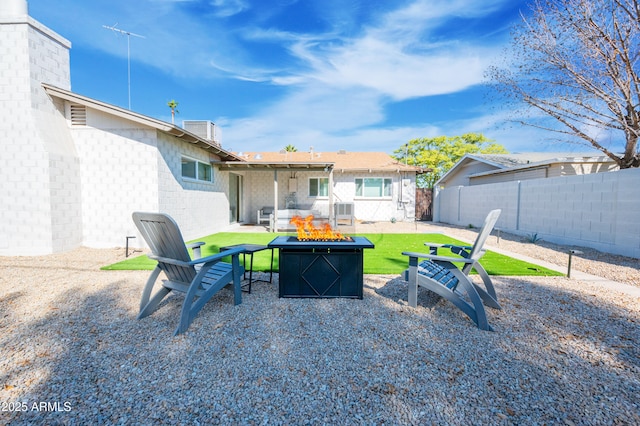 view of patio with a fire pit