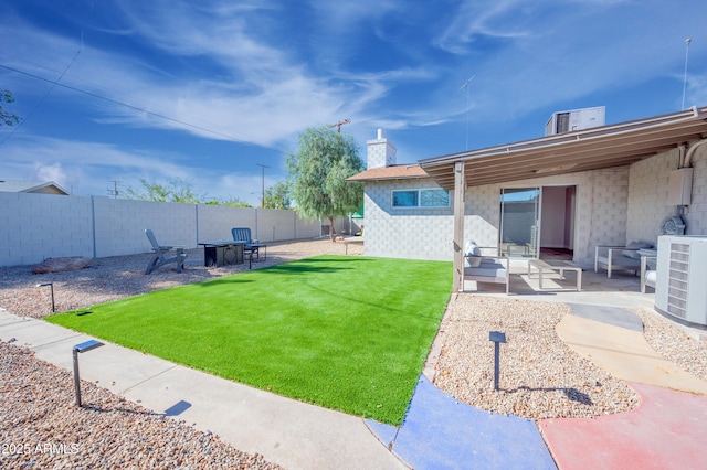 view of yard featuring a patio and central air condition unit