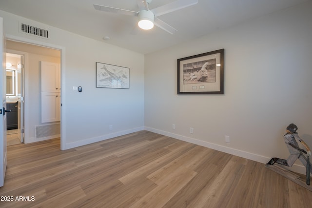 unfurnished room with light hardwood / wood-style flooring and ceiling fan