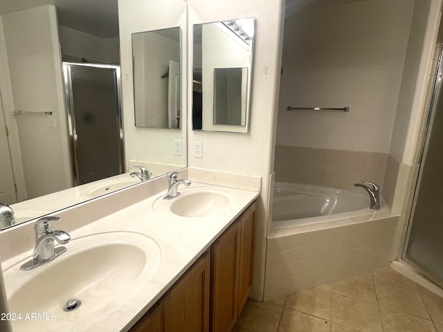 bathroom featuring tile patterned flooring, vanity, and plus walk in shower