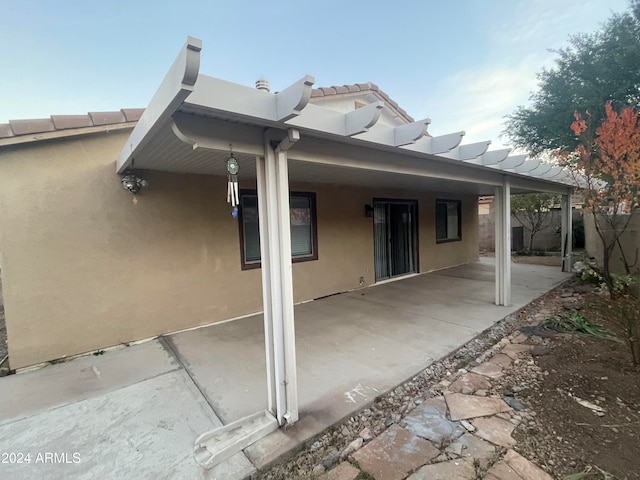 rear view of property featuring a patio