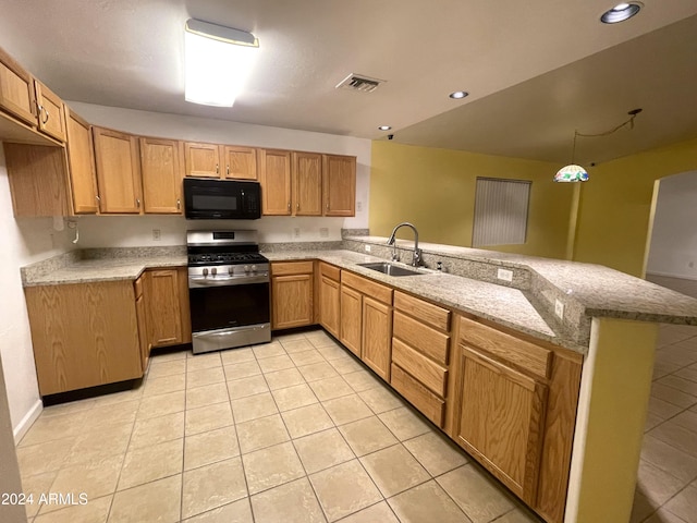 kitchen with kitchen peninsula, stainless steel gas stove, light tile patterned flooring, and sink