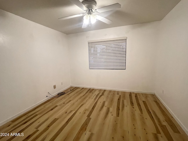 spare room with ceiling fan and light hardwood / wood-style flooring