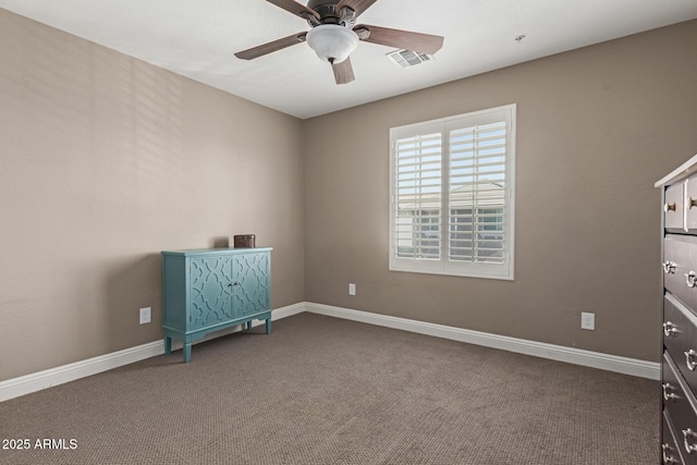 unfurnished bedroom featuring a ceiling fan, carpet flooring, visible vents, and baseboards