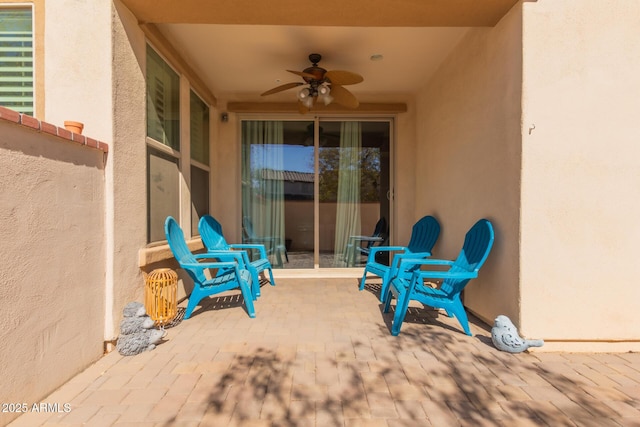 view of patio featuring ceiling fan