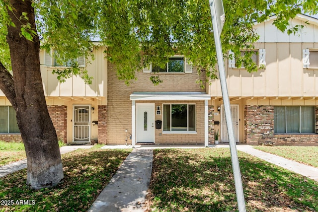 18 E Hermosa Dr Unit 18, Tempe, AZ 85282 - view of property featuring brick siding and board and batten siding