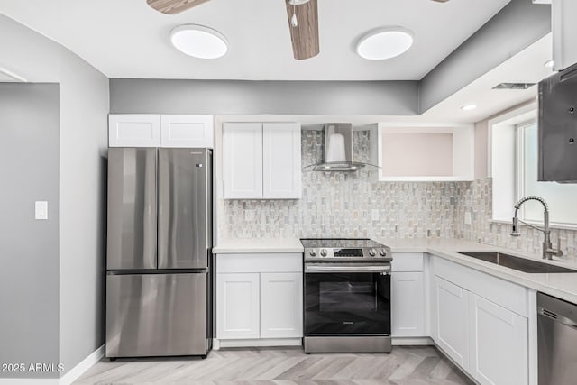 18 E Hermosa Dr Unit 18, Tempe, AZ 85282 - kitchen with appliances with stainless steel finishes, wall chimney range hood, white cabinets, and backsplash