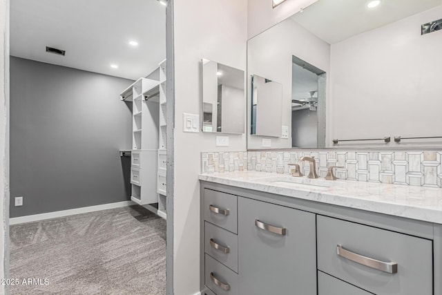 18 E Hermosa Dr Unit 18, Tempe, AZ 85282 - bathroom featuring vanity, a ceiling fan, backsplash, and recessed lighting