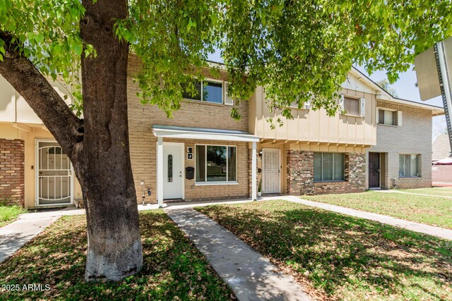 18 E Hermosa Dr Unit 18, Tempe, AZ 85282 - multi unit property with brick siding, a front lawn, and board and batten siding