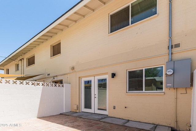 18 E Hermosa Dr Unit 18, Tempe, AZ 85282 - rear view of property with french doors, a patio area, and concrete block siding