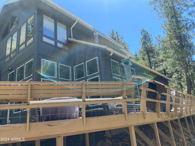 back of house with a wooden deck