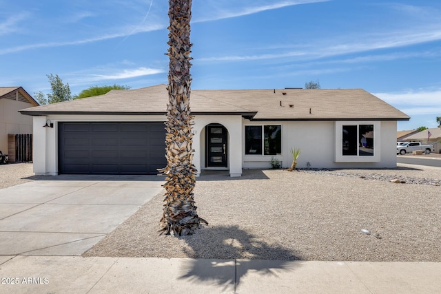 3011 E John Cabot Dr, Phoenix, AZ 85032 - single story home featuring an attached garage, concrete driveway, roof with shingles, and stucco siding